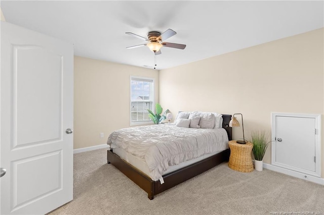 bedroom with baseboards, carpet floors, and ceiling fan