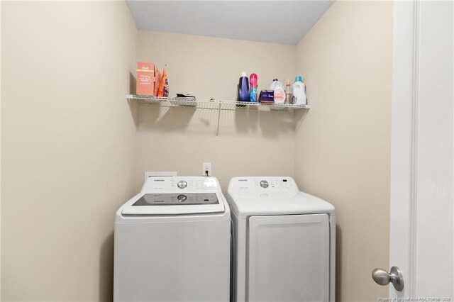 laundry area featuring laundry area and independent washer and dryer