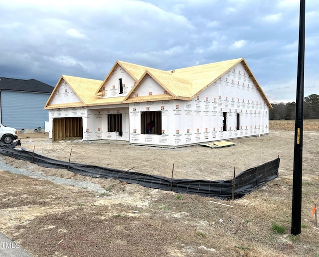 unfinished property with a garage