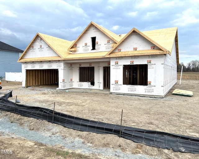 property in mid-construction with an attached garage