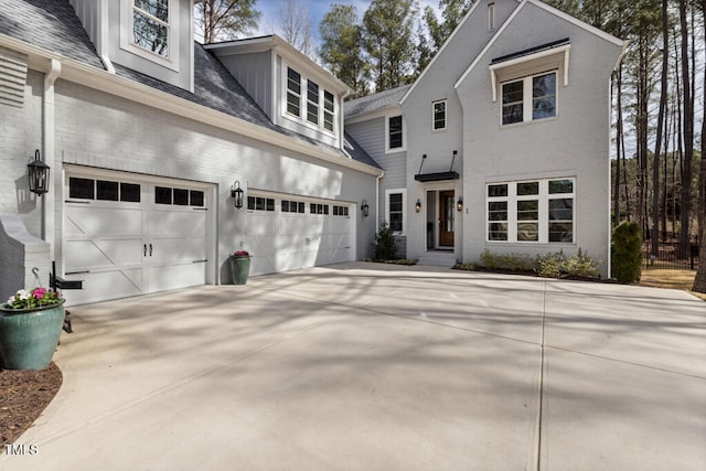 view of front of property with brick siding and driveway