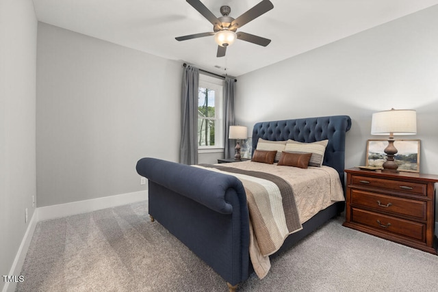 bedroom with a ceiling fan, carpet, and baseboards