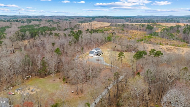 aerial view featuring a wooded view