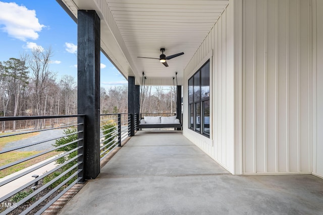 view of patio / terrace featuring a balcony and a ceiling fan