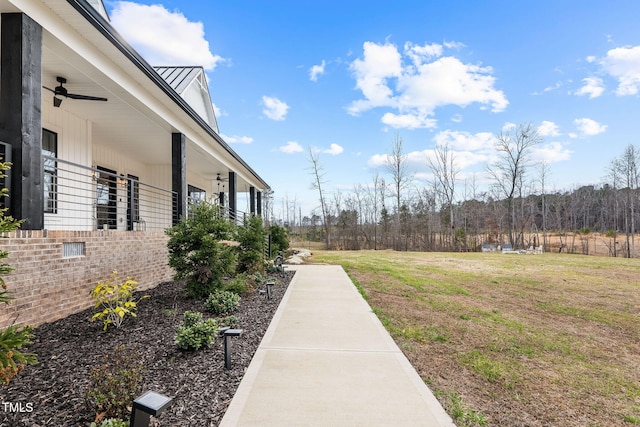 view of yard featuring ceiling fan