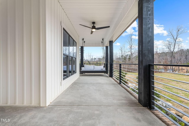 view of patio featuring a balcony and a ceiling fan