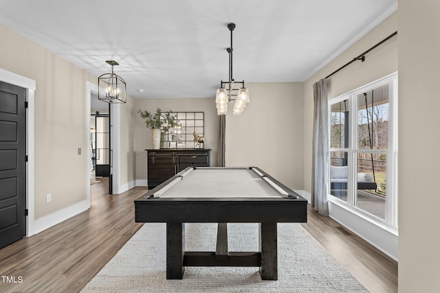 playroom featuring a chandelier, billiards, baseboards, and wood finished floors