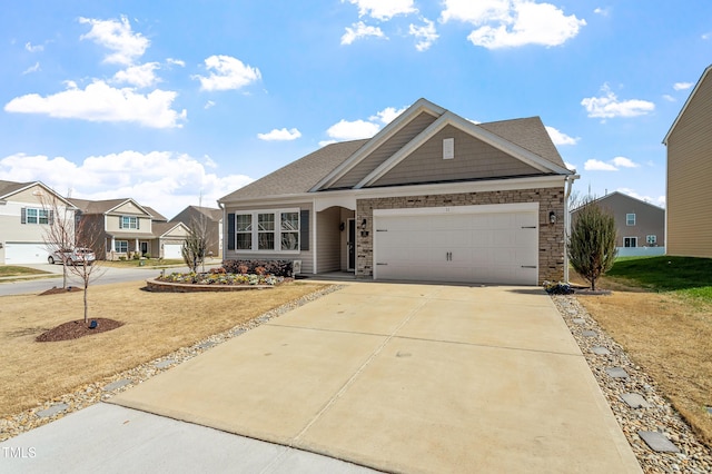 view of front facade featuring concrete driveway, an attached garage, stone siding, and a residential view