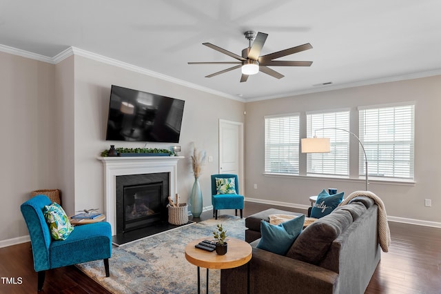 living room featuring ceiling fan, wood finished floors, and crown molding