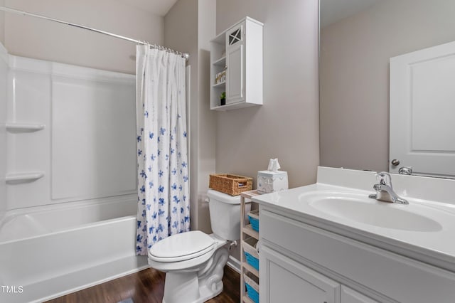 bathroom with shower / bathtub combination with curtain, toilet, wood finished floors, and vanity