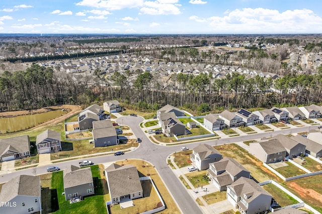 birds eye view of property with a residential view