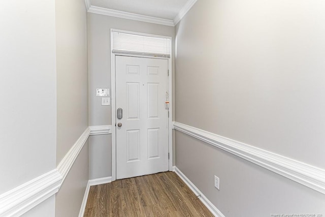 doorway to outside with wood finished floors, baseboards, and ornamental molding