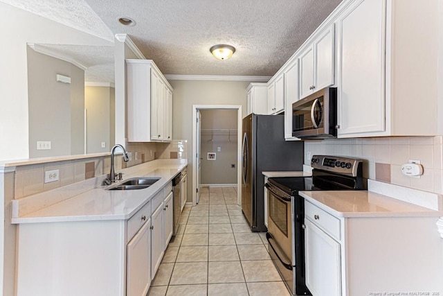 kitchen featuring a sink, backsplash, stainless steel appliances, white cabinets, and crown molding