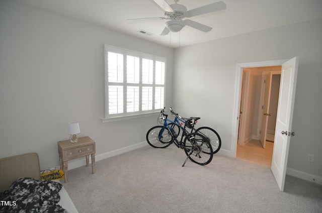 misc room featuring visible vents, baseboards, carpet, and a ceiling fan