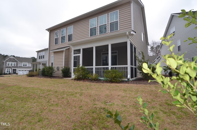 view of front of house featuring a front yard and a sunroom