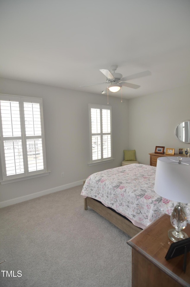 bedroom featuring carpet flooring, ceiling fan, and baseboards