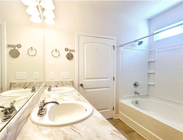 full bathroom featuring tile patterned floors, shower / bath combination, and a sink