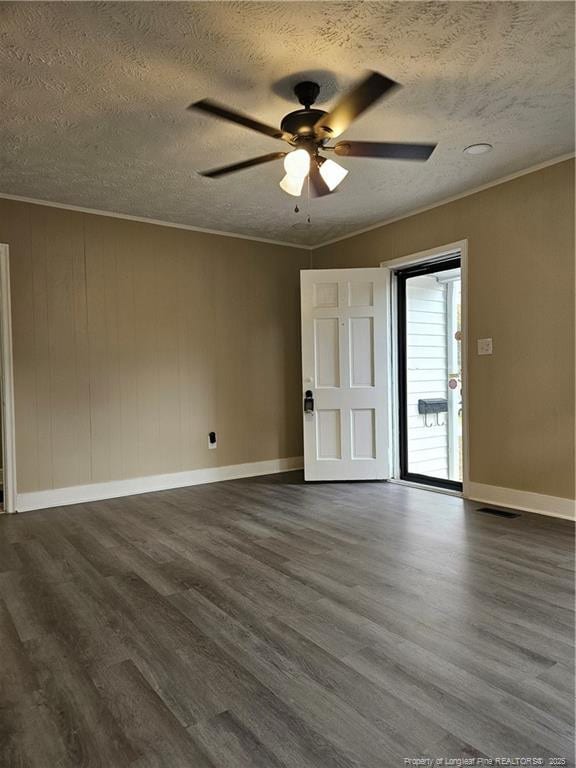 unfurnished room with dark wood-style floors, ceiling fan, and ornamental molding