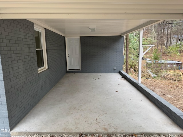 view of patio featuring an attached carport