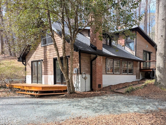 view of front of home featuring a shingled roof