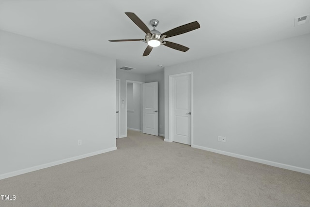 unfurnished bedroom featuring visible vents, baseboards, and light carpet