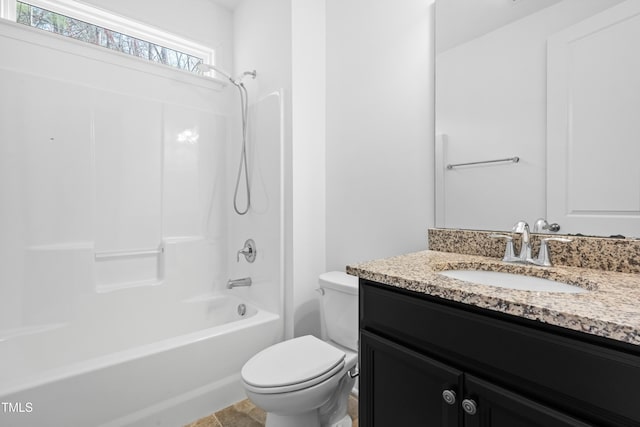 full bathroom featuring vanity, toilet, and tub / shower combination