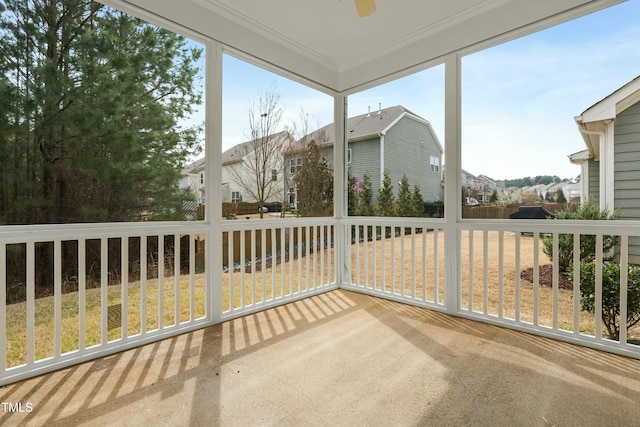 unfurnished sunroom featuring a residential view