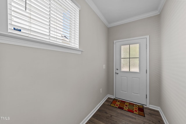 entryway with crown molding, baseboards, and wood finished floors