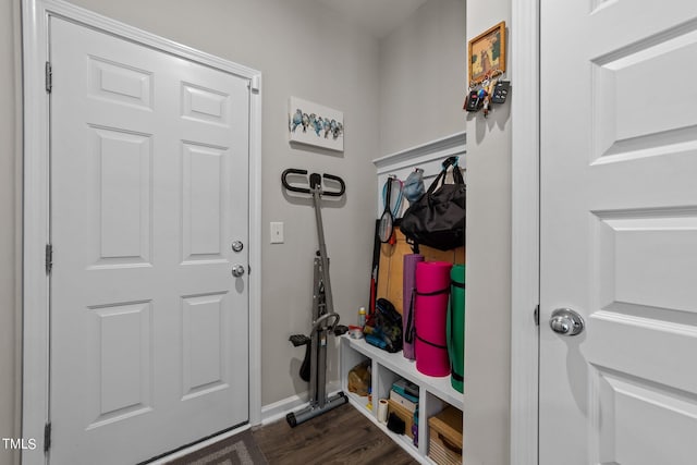 mudroom featuring dark wood-style floors and baseboards