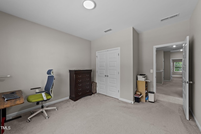 carpeted home office with baseboards and visible vents