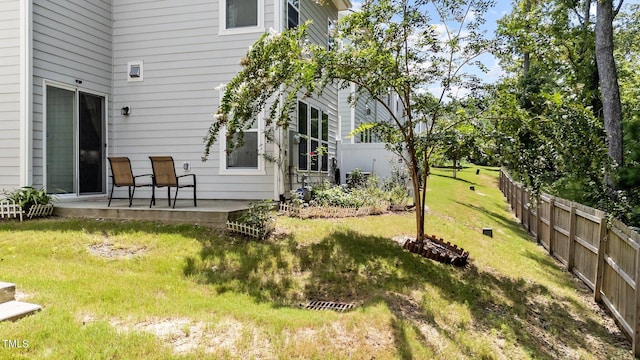 view of yard featuring a patio area and fence