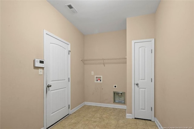 laundry area featuring laundry area, hookup for a washing machine, baseboards, and hookup for an electric dryer