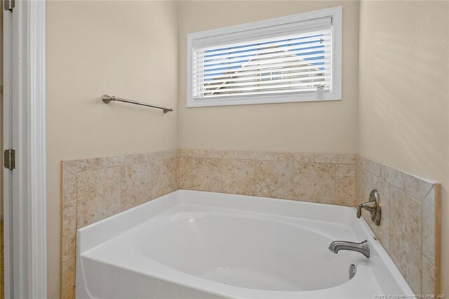 full bathroom featuring a garden tub