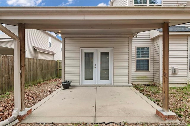 view of patio / terrace featuring fence and french doors