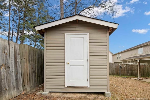 view of shed with a fenced backyard