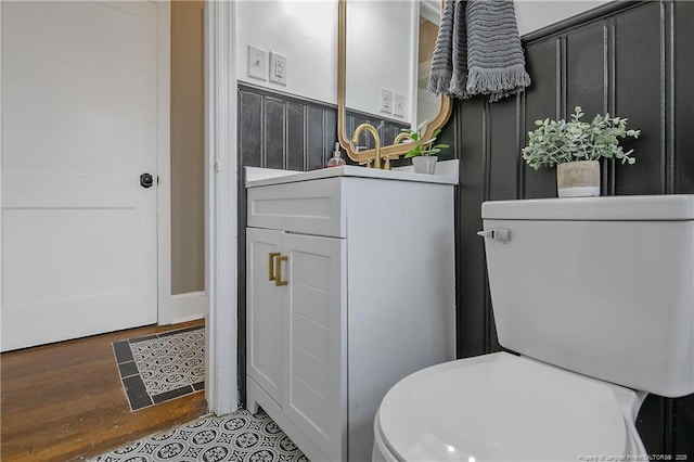 bathroom featuring toilet and wood finished floors