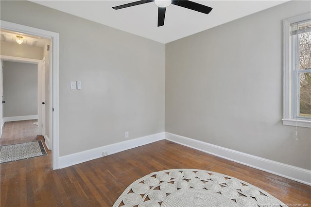 interior space with ceiling fan, baseboards, and wood finished floors