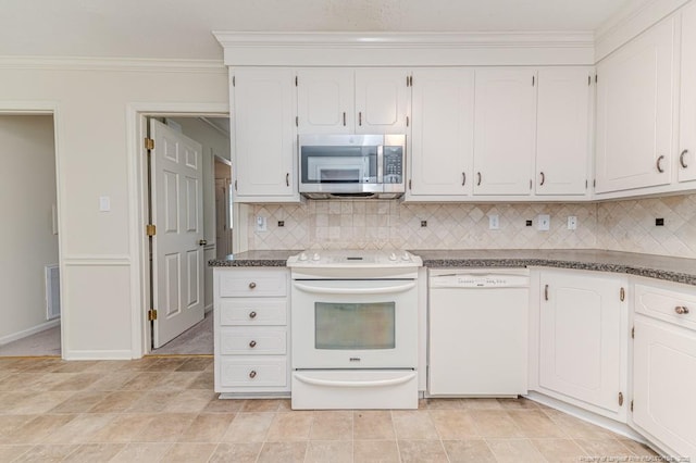 kitchen featuring white appliances, white cabinets, crown molding, and tasteful backsplash