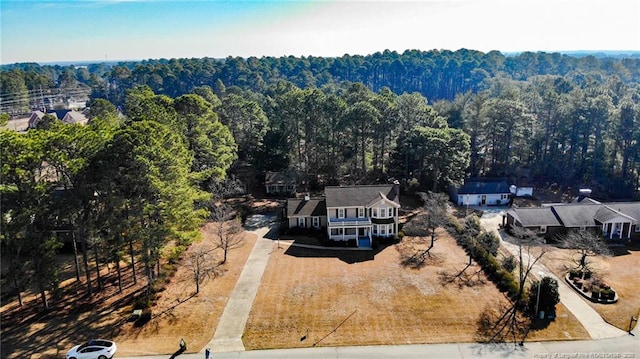 bird's eye view featuring a forest view