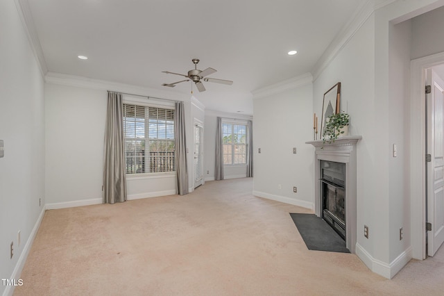 unfurnished living room with a ceiling fan, a fireplace with flush hearth, light colored carpet, and ornamental molding