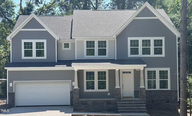 craftsman house featuring crawl space, concrete driveway, a porch, a garage, and roof with shingles