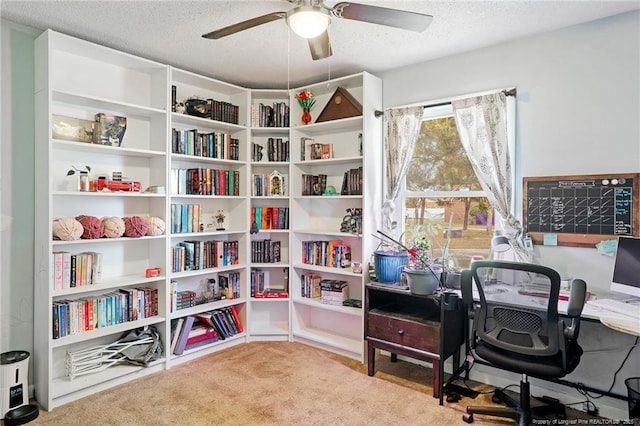 office space featuring ceiling fan, carpet, and a textured ceiling