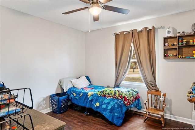 bedroom with wood finished floors, baseboards, and ceiling fan