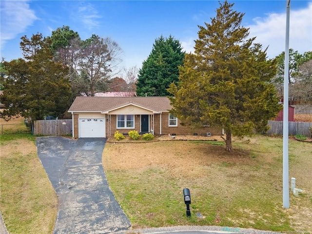 ranch-style house featuring an attached garage, fence, brick siding, and driveway