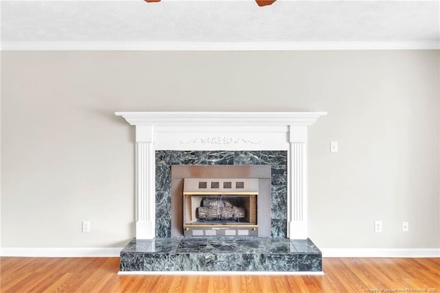 details with crown molding, baseboards, and wood finished floors