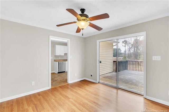 empty room featuring baseboards, light wood-style floors, and a ceiling fan