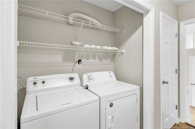 laundry room with washing machine and dryer and laundry area