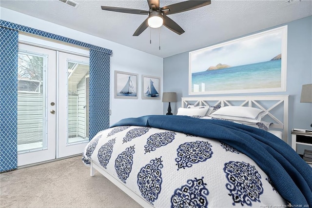 carpeted bedroom with visible vents, ceiling fan, french doors, a textured ceiling, and access to outside