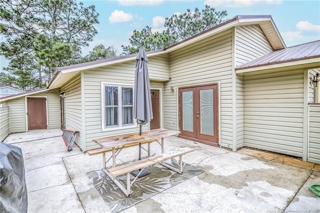 back of property with french doors and a patio