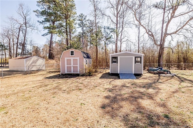 view of shed featuring fence